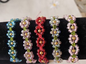 Glass bead flowers on macrame bracelet